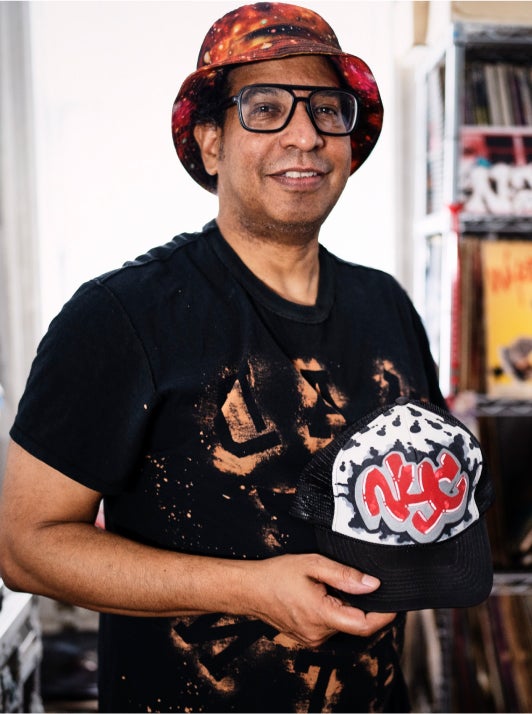 small business owner holding hat