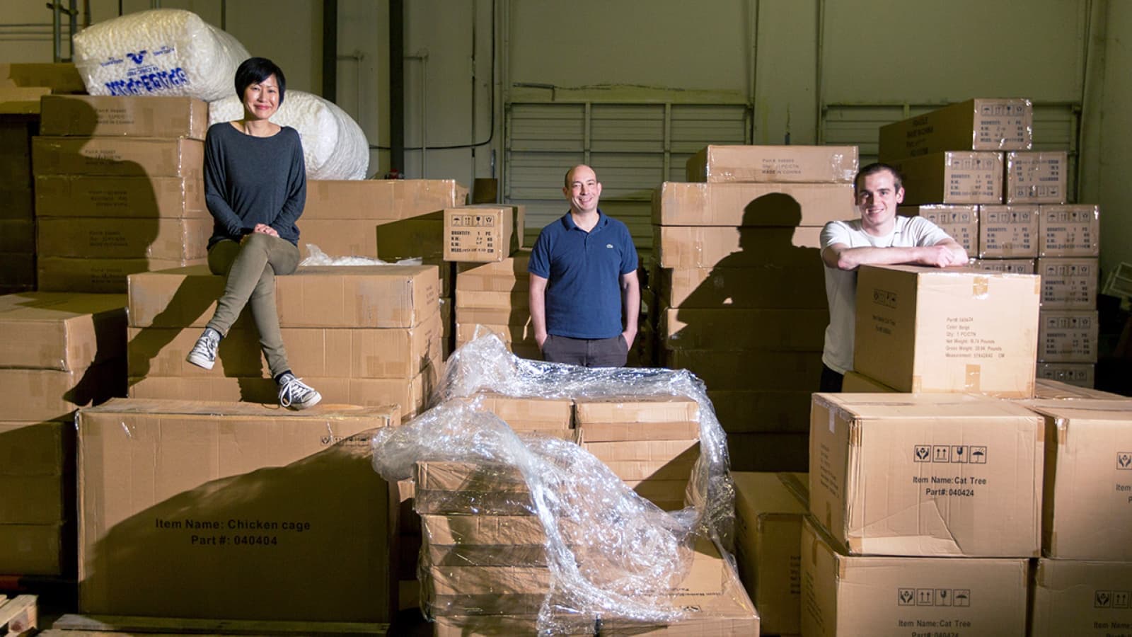 Team members standing around boxes