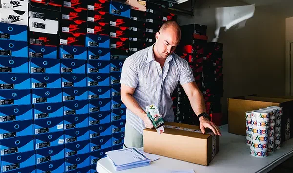 Man packaging a box