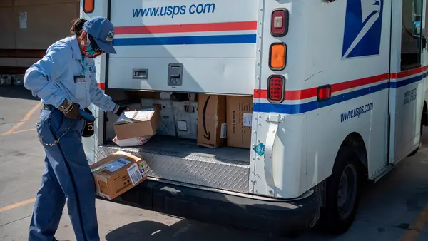 USPS worker handling packages