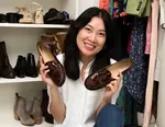eBay Seller Michelle Nguyen holding a pair of brown shoes