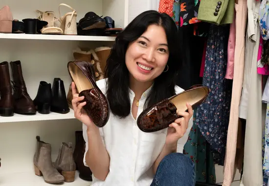 eBay Seller Michelle Nguyen holding a pair of brown shoes