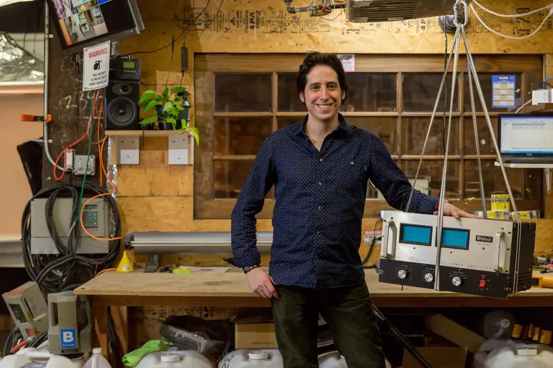 Man posing with machine